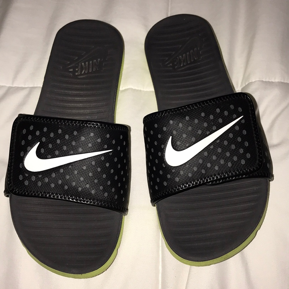 Size 8 black and lime green Nike slides